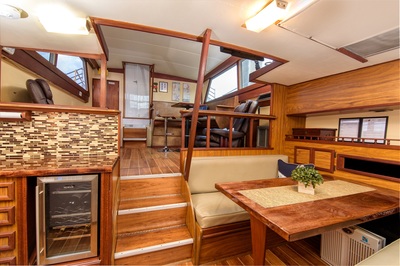 Yacht Charter guests have access to a full-size galley with a refrigerator, wine cooler, and seating