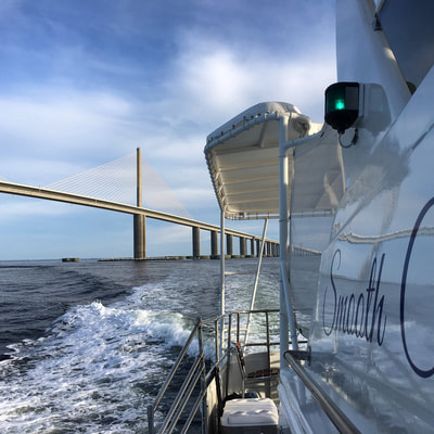 Cruise to the iconic Sunshine Skyway Bridge aboard the Smooth C's yacht charter in St Petersburg, Tampa, Sarasota, and St Pete Beach